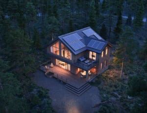 Modern cabin with solar panels in woods.